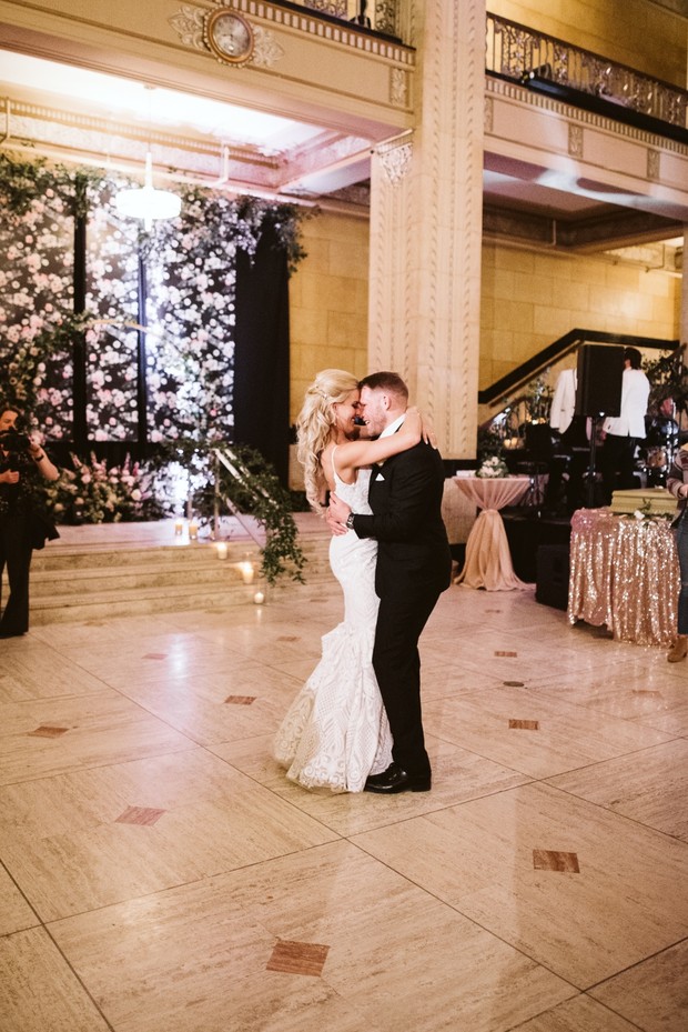 Joyful bride and groom share first dance at wedding reception
