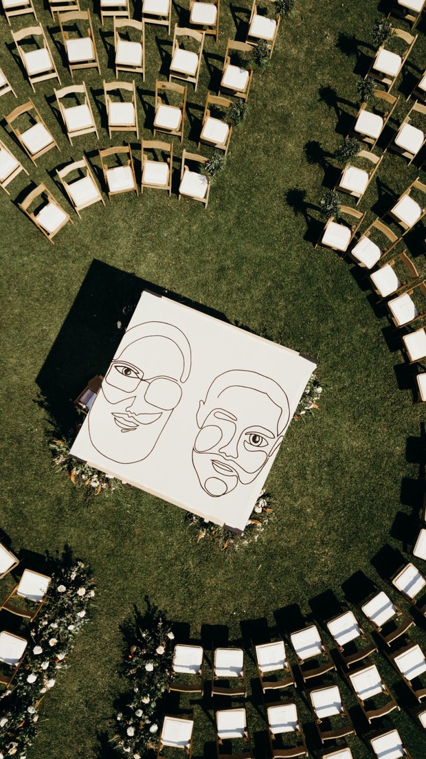 Aerial view of unique wedding portrait backdrop on lawn