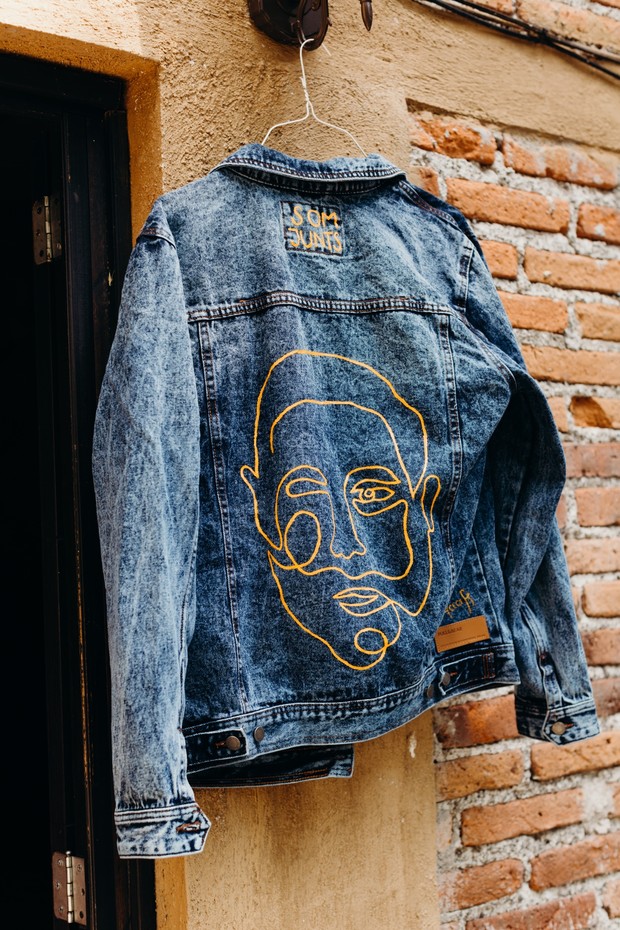 Hand-painted denim jacket with abstract face design