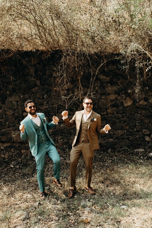 Happy grooms joyfully celebrating their wedding day