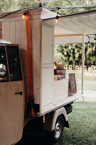 Vintage mobile cafe truck with string lights outdoor