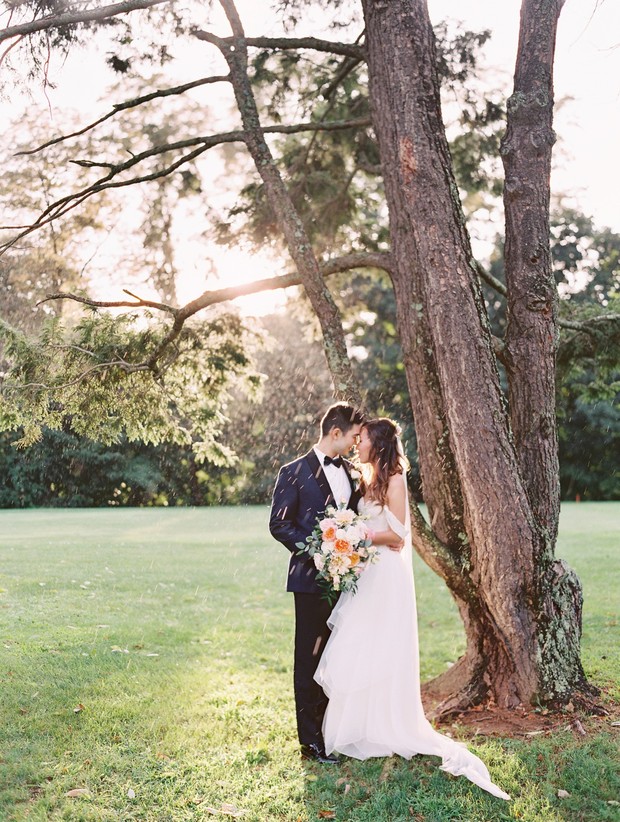 Romantic wedding moment with bride and groom in garden