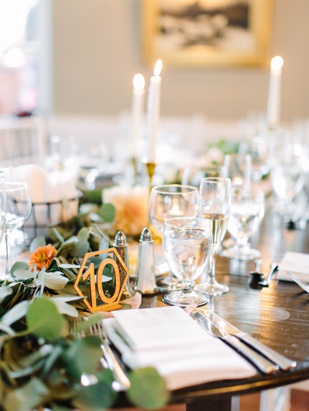 Elegant wedding table setting with table number ten and candles