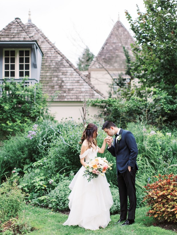Bride and groom in garden wedding fairytale setting