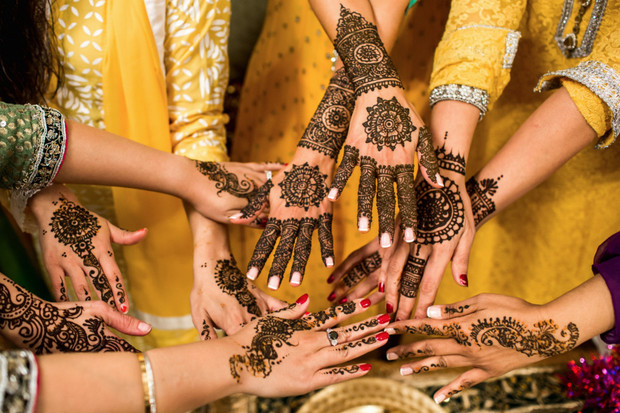 Hands with henna designs for a cultural event