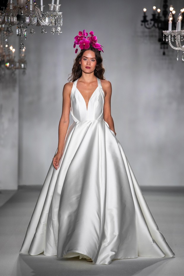 Model in satin halter wedding dress with flower crown