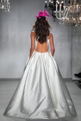 Elegant backless satin wedding gown with flower crown