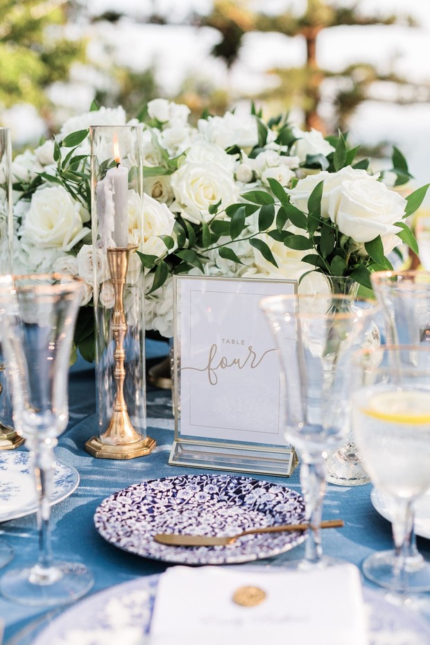 Elegant wedding table four setting with white flowers