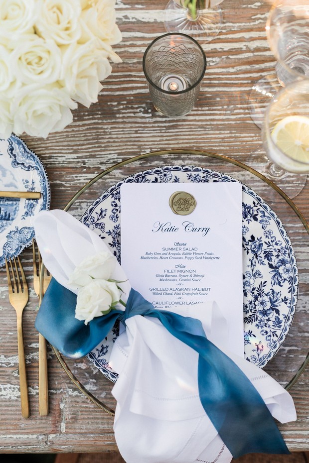 Elegant wedding place setting with blue and white china