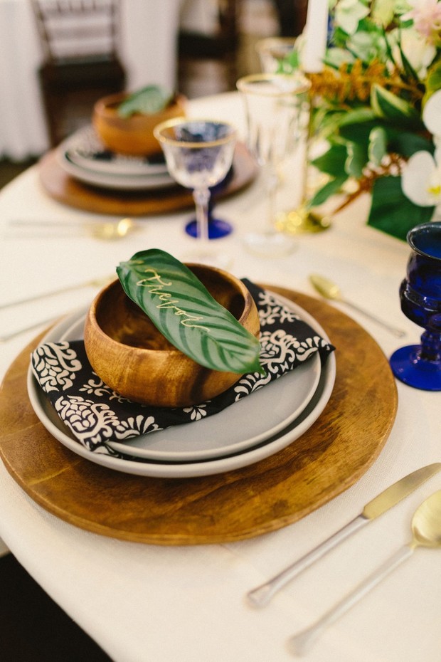 wood and bold patterned wedding place setting