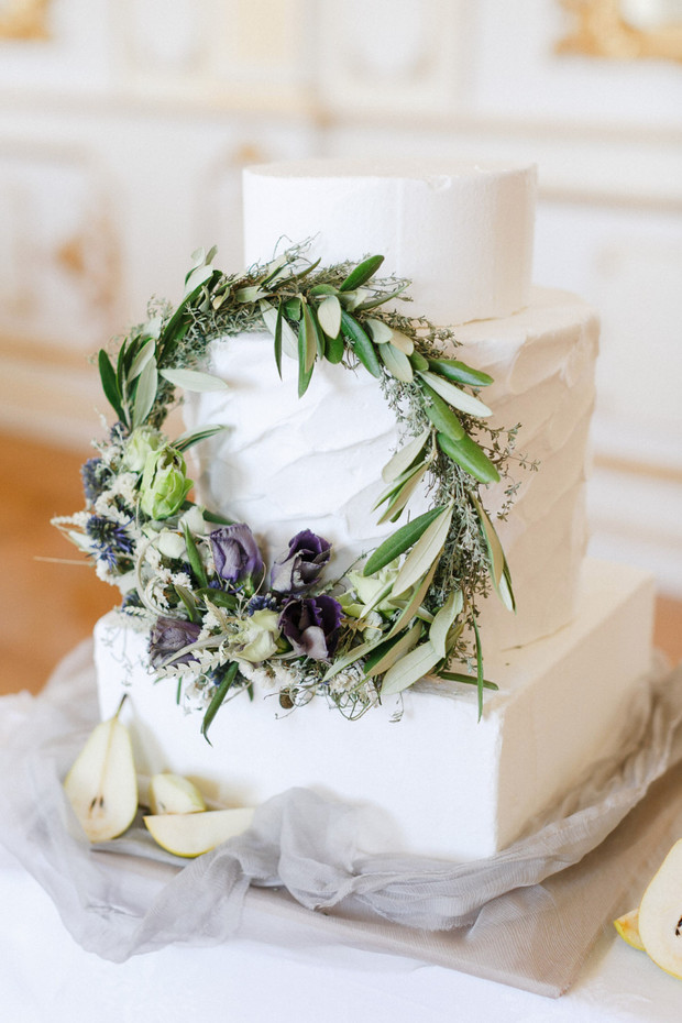 white wedding cake with wreath