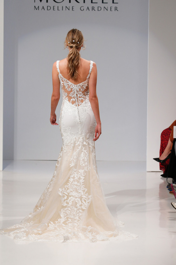 Bride wears Morilee lace back wedding dress on runway