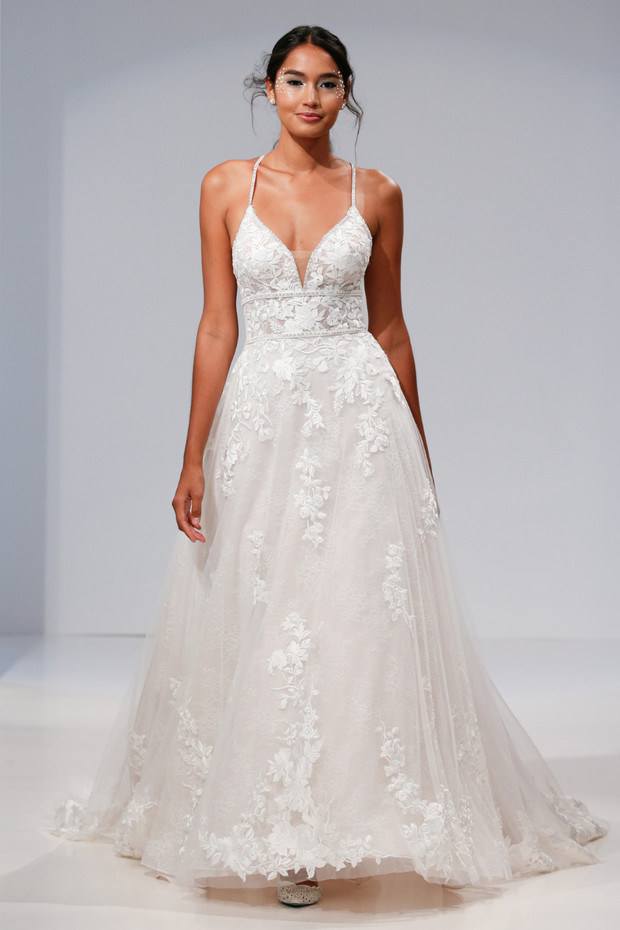 Bride wears A line lace gown with spaghetti straps