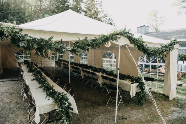 tent wedding reception with greenery