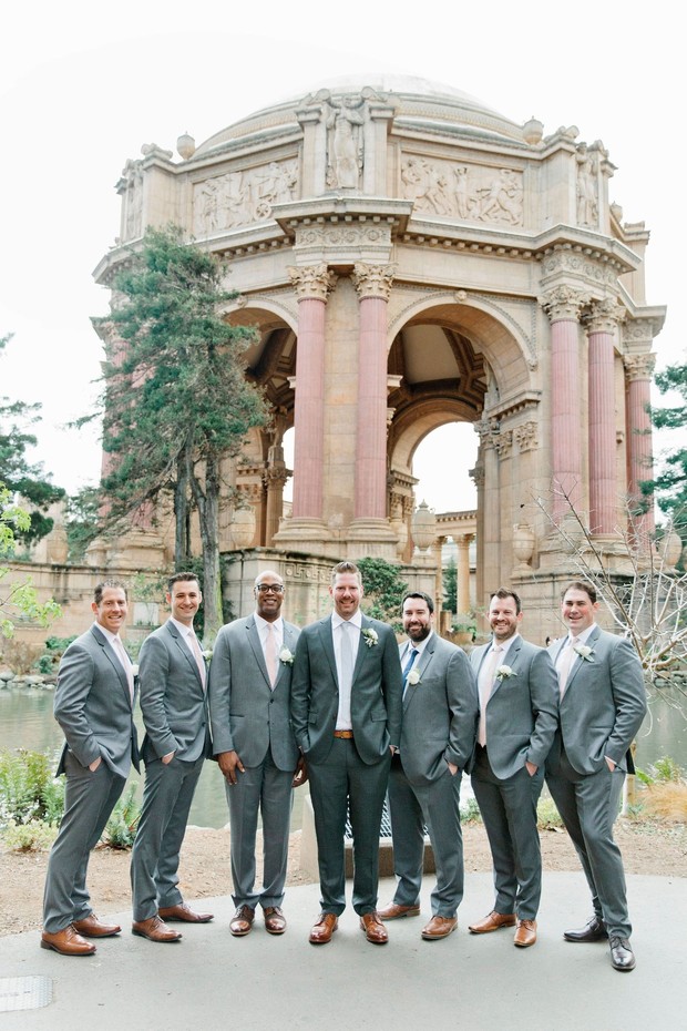 groom and his men in matching grey suits