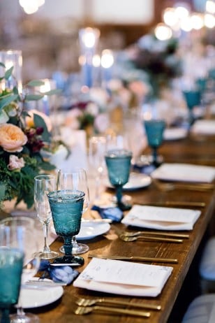 gold and blue family style wedding reception seating