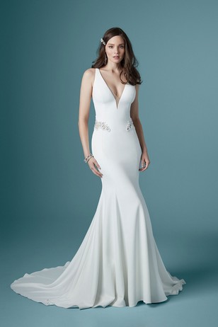 Stunning V-neck mermaid wedding gown with embellished waist