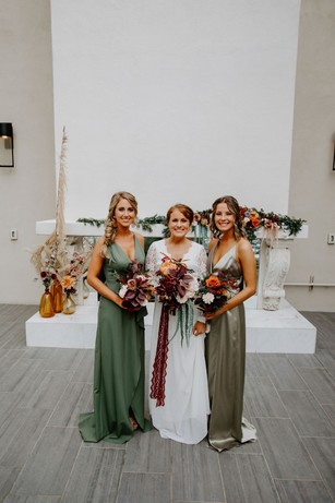 bride and bridesmaids in sage and green