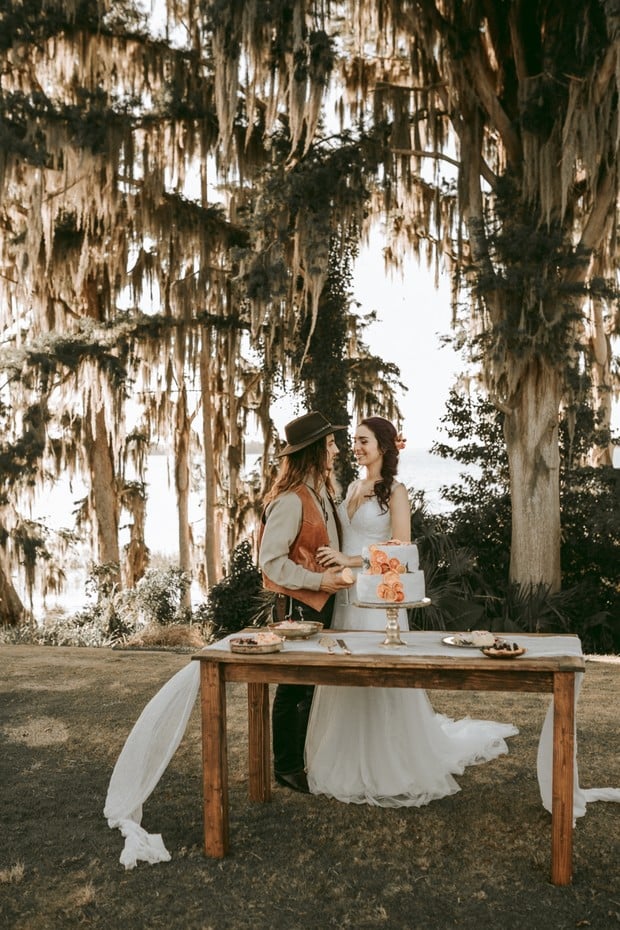 sweet wedding couple and their cake table