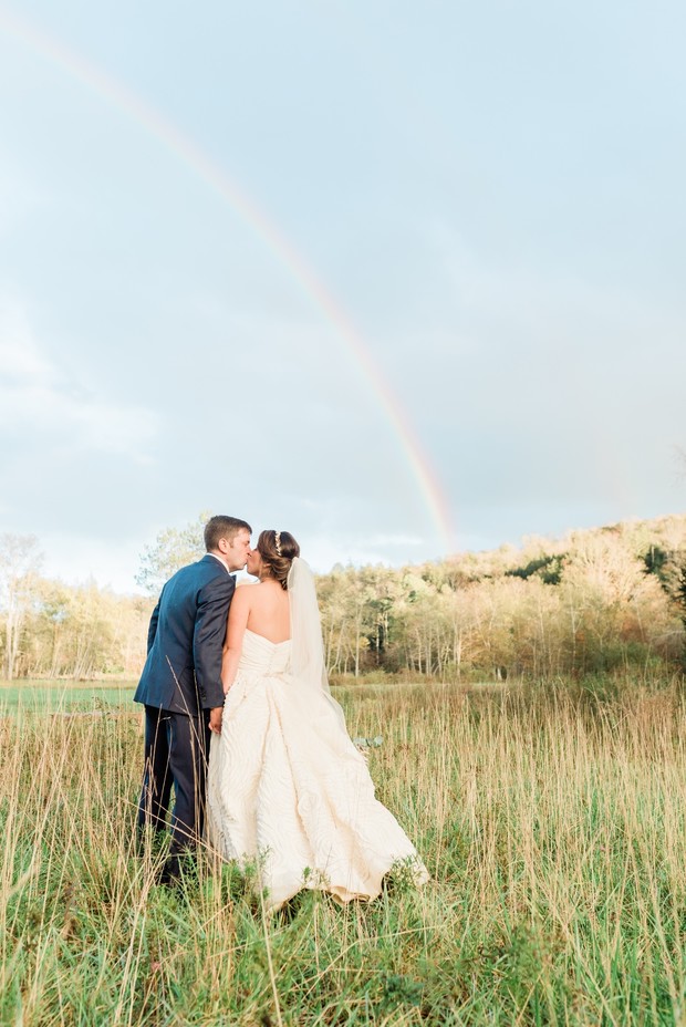 a wedding with a rainbow