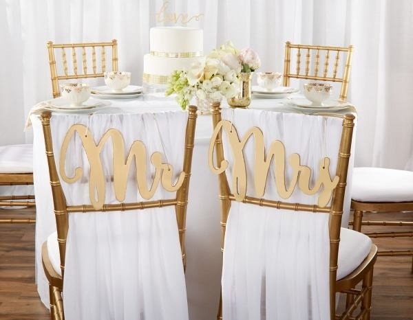 Wedding reception table with Mr and Mrs chair signs