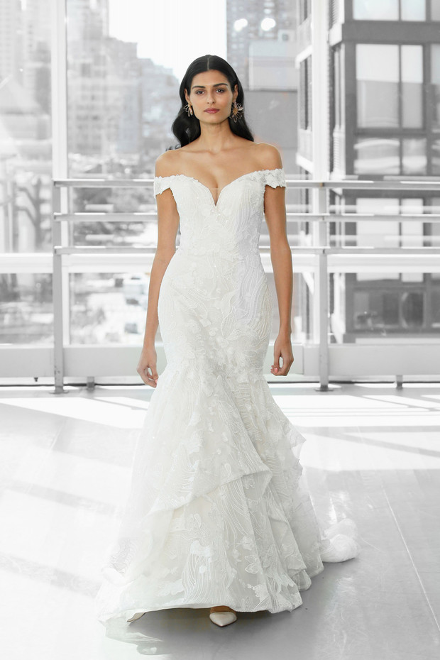 Elegant bride in off-shoulder wedding dress, ready for her big day