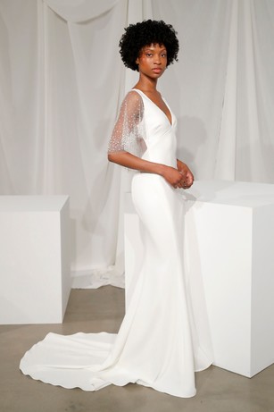 Elegant bride in a white mermaid style wedding gown