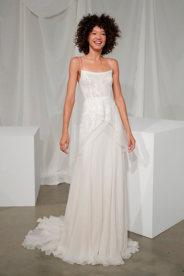 Woman in a light airy wedding gown with thin straps