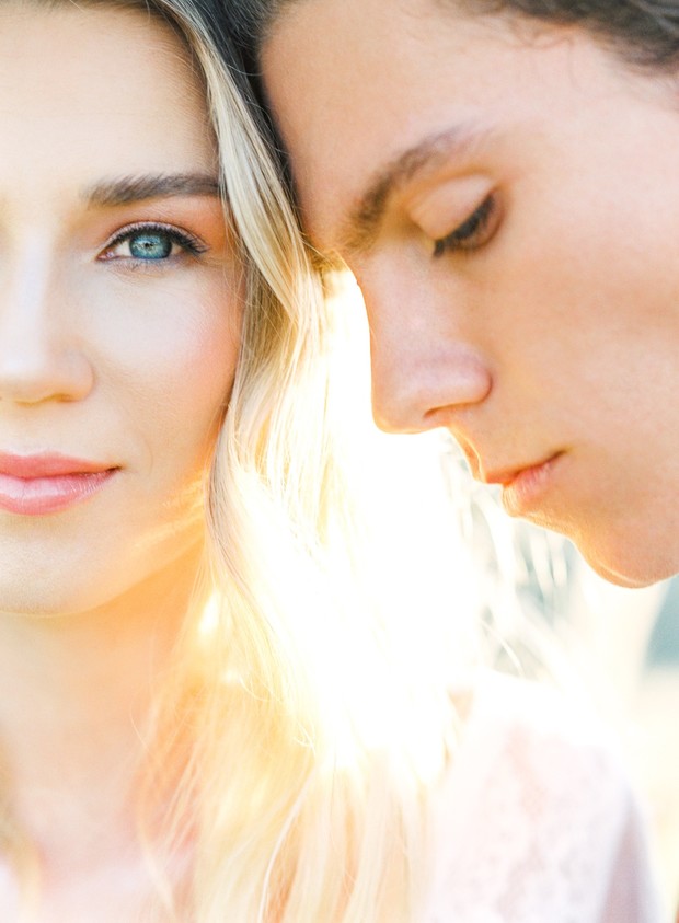 Close up portrait of a loving couple in bright sunlight