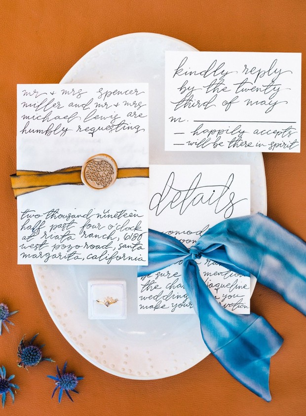 Elegant wedding invitation suite with calligraphy details