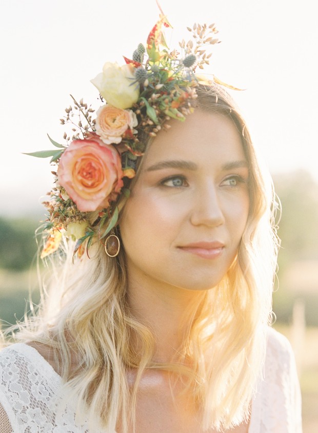 Woman wearing a beautiful floral crown in warm light