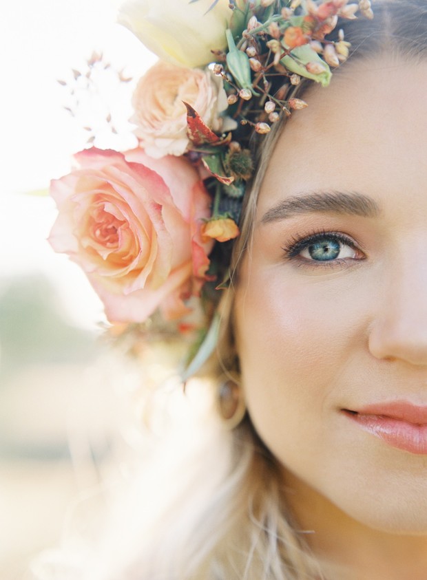 Bride portrait with floral crown and blue eyes detail