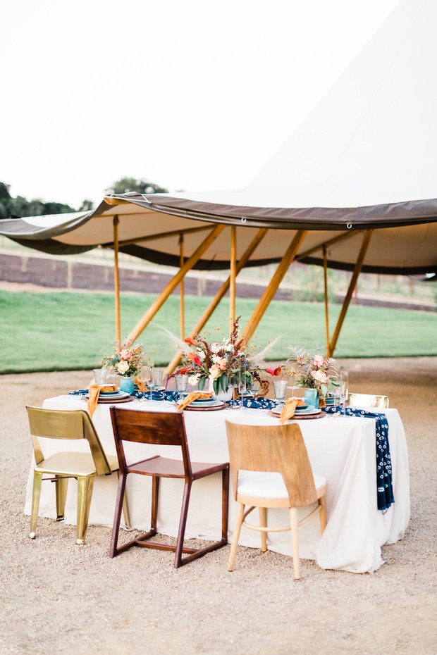 Elegant outdoor wedding reception table setting and chairs