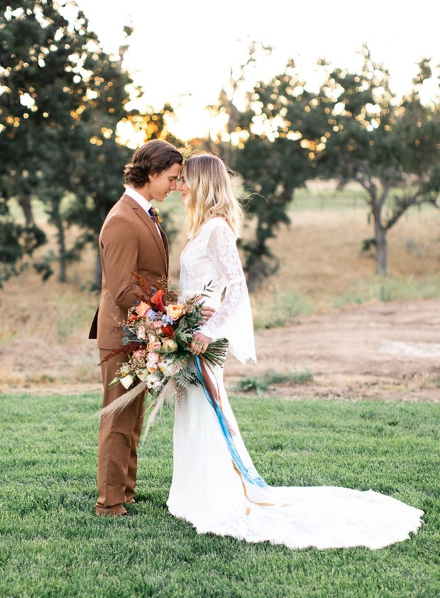 Elegant bride and groom in rustic chic wedding attire