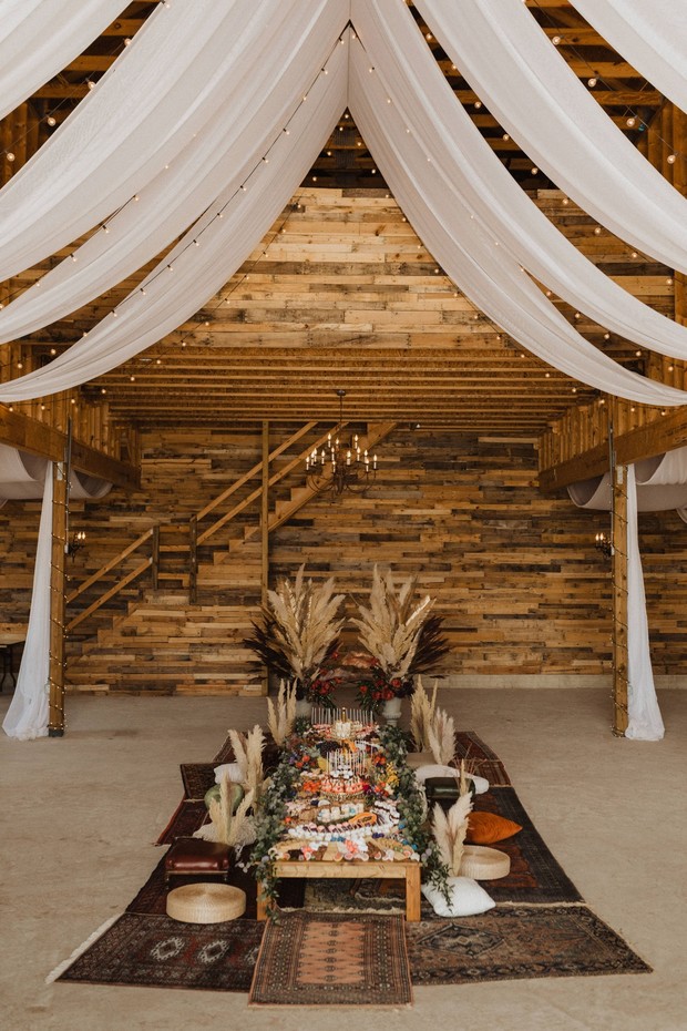 a boho pillow seating style wedding table