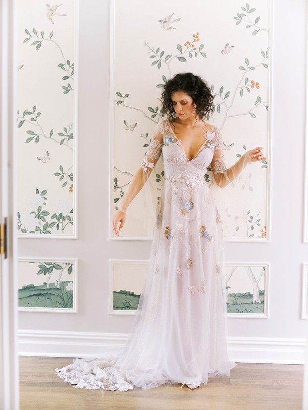 Bride in an embroidered tulle wedding dress indoors