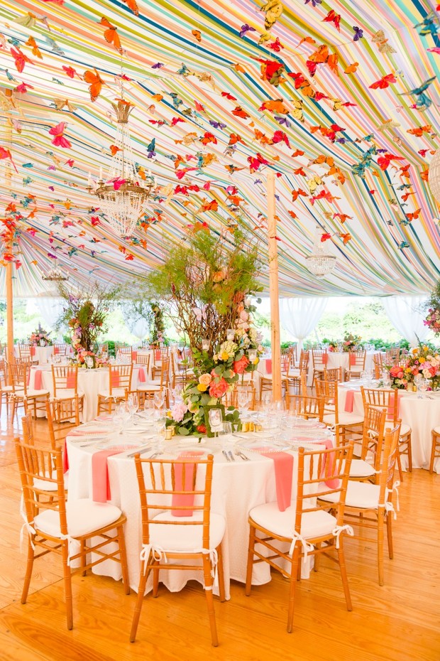 Elegant tent wedding reception with butterfly decor