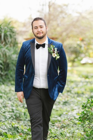 groom in velvet suit jacket