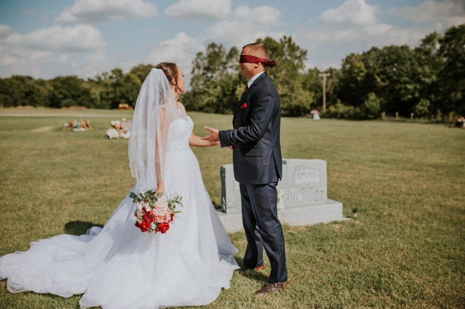 Bride surprising groom with first look at mother's gravesite