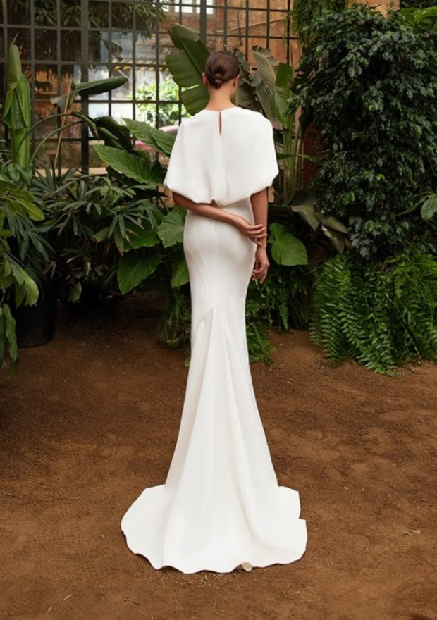 Back view of bride in elegant white mermaid wedding dress