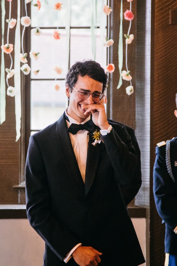Groom wipes tears of joy, overcome with emotion at the wedding