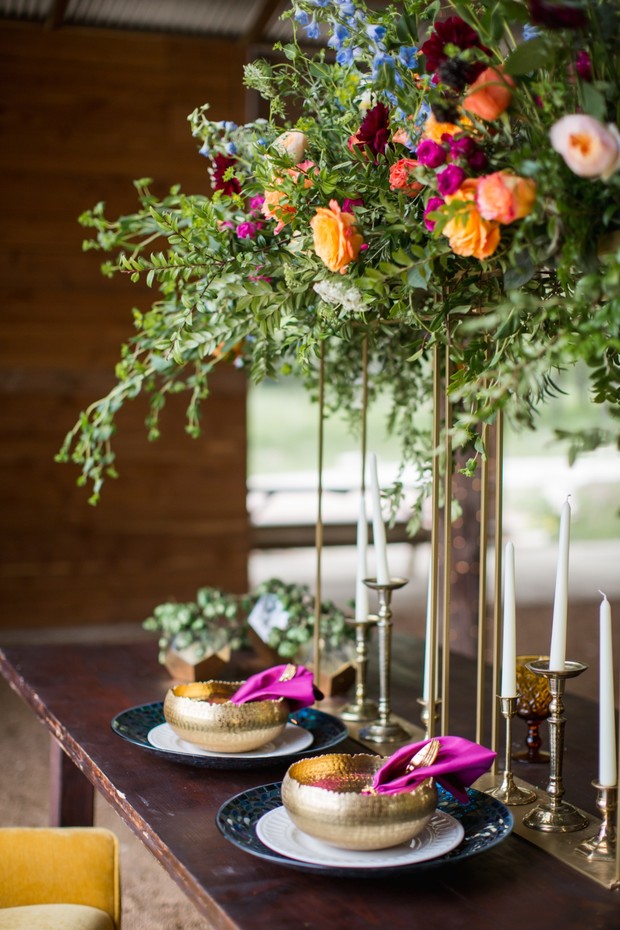 Elegant wedding table setting with floral centerpiece and candles