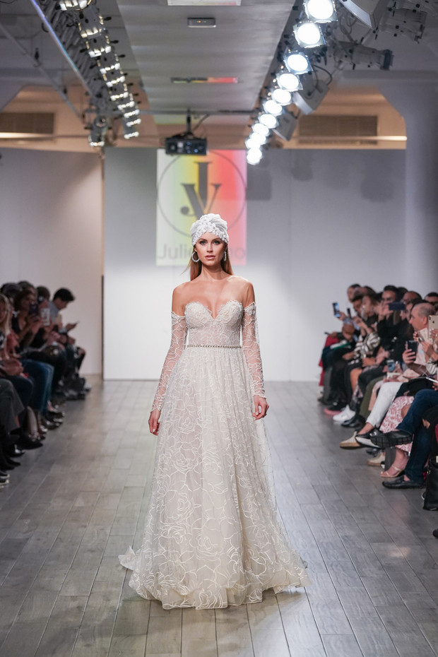 Bride in a stunning wedding dress on a fashion runway