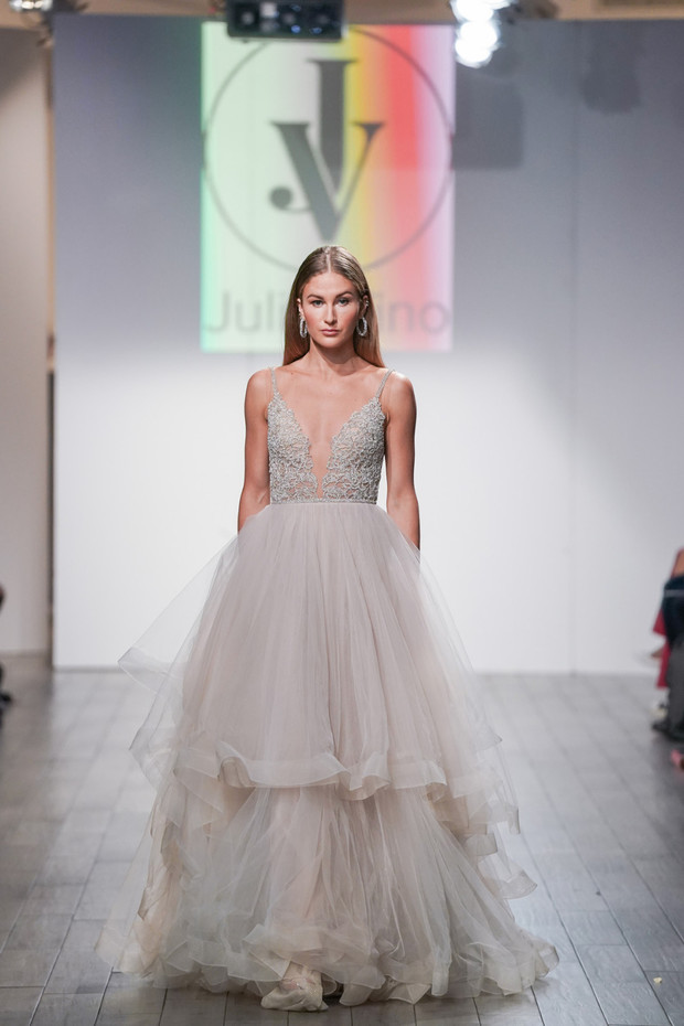 Fashion model in an elegant wedding dress on the runway