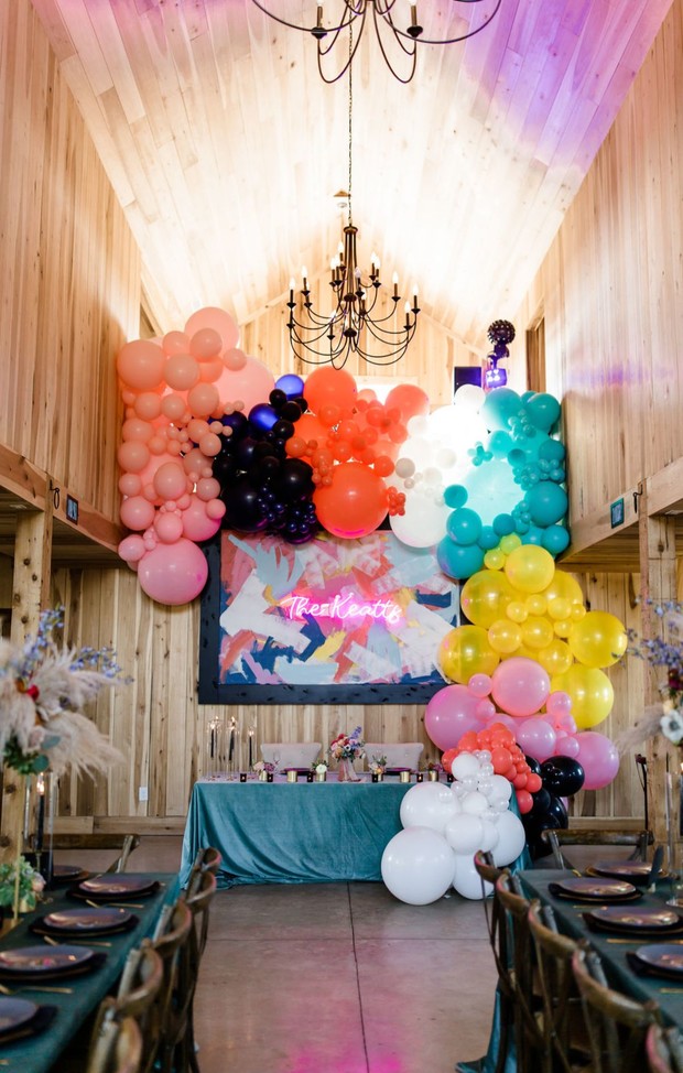 giant balloon installation sweethearts table