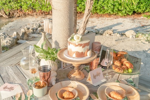 gold and white wedding breakfast at the beach