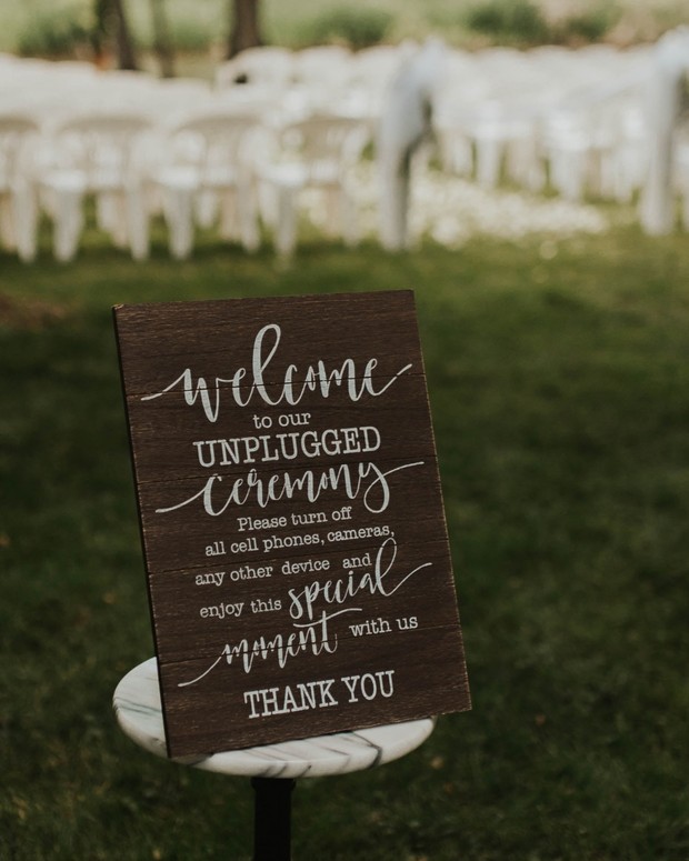 Wedding ceremony sign encouraging guests to disconnect