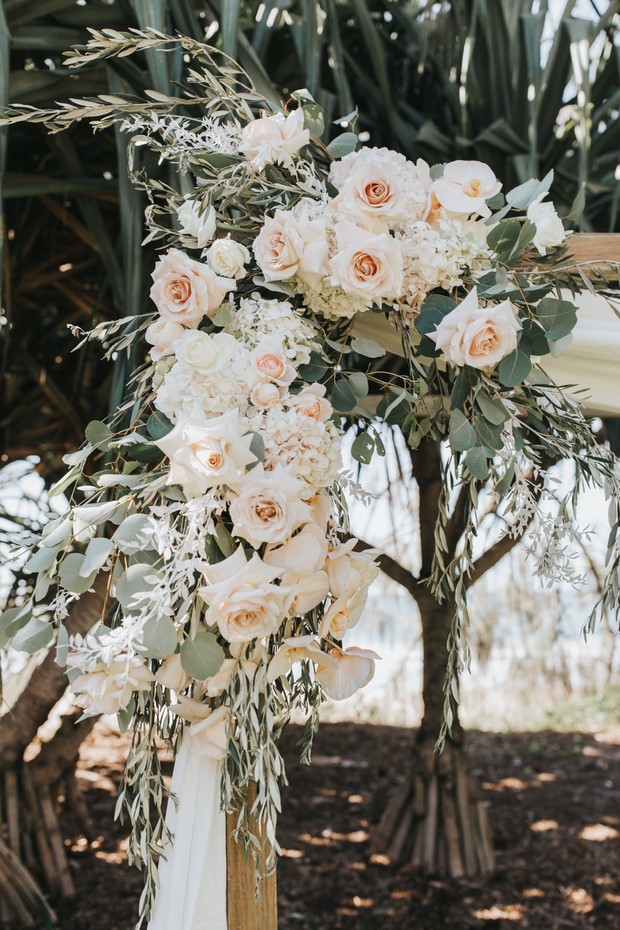 Elegant floral arrangement for wedding ceremony in natural light