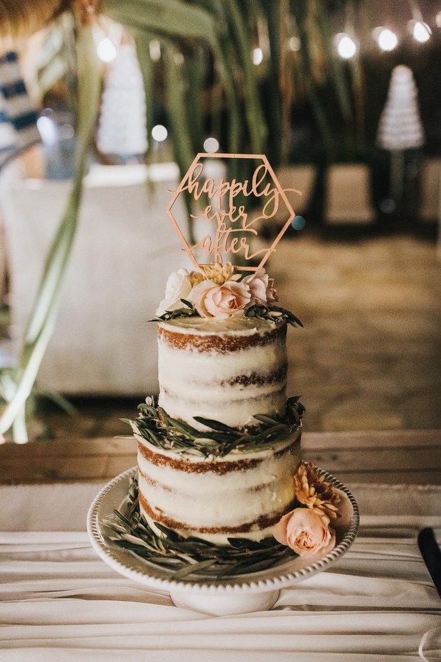 Wedding cake with happily ever after topper and floral details