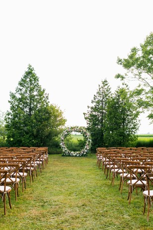 wedding ceremony with giant floral wreath